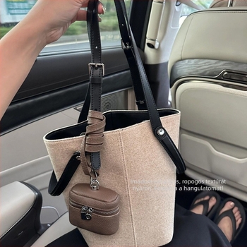 Lenvászonból készült nagy kapacitású bucket táska, prémium érzetű, sokoldalú hordhatóság vállon vagy alkaron, női retro commuter stílus.