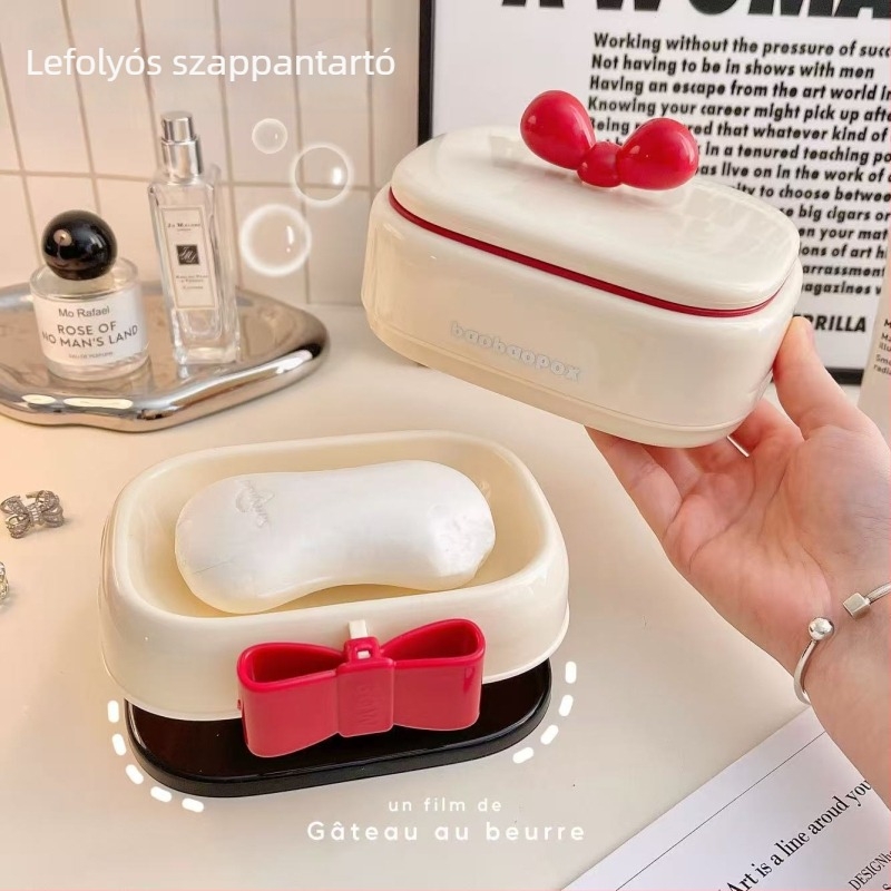 Új krém-fehér szappanestál fedővel, fürdőszobába, leeresztő tartóval, elegáns otthoni kiegészítő.