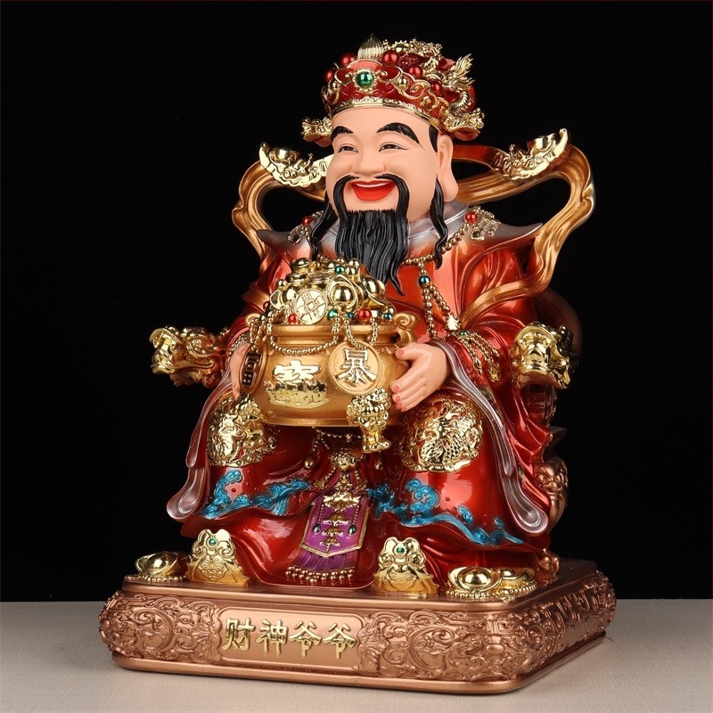 Gyanta Buddha szobor – A Bőség Istene, piros ruhában, aranyozott felület, aranytallér motívummal, imádásra
