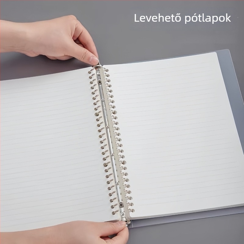 Fém klipekkel ellátott jegyzetfüzet, matt PP burkolattal, A5-ös méret, oldalai rácsos és vízszintes vonalas, spirálhoz cserélhető betét