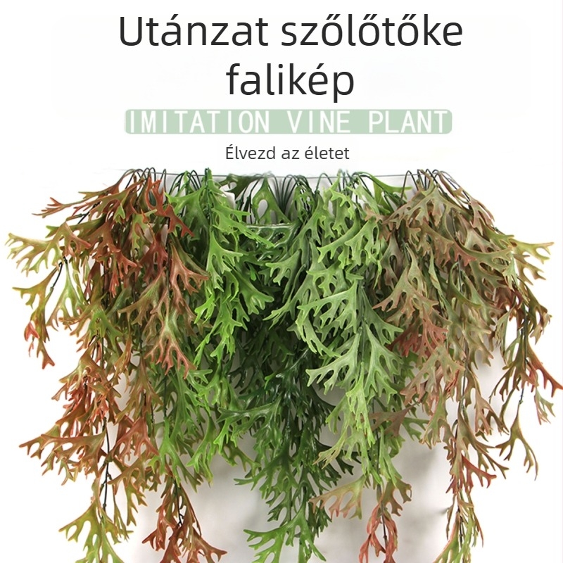 Dekoratív falikép műanyag növényekből, antler-szerű levelekkel, páfrányokkal és zöld ratán díszítéssel