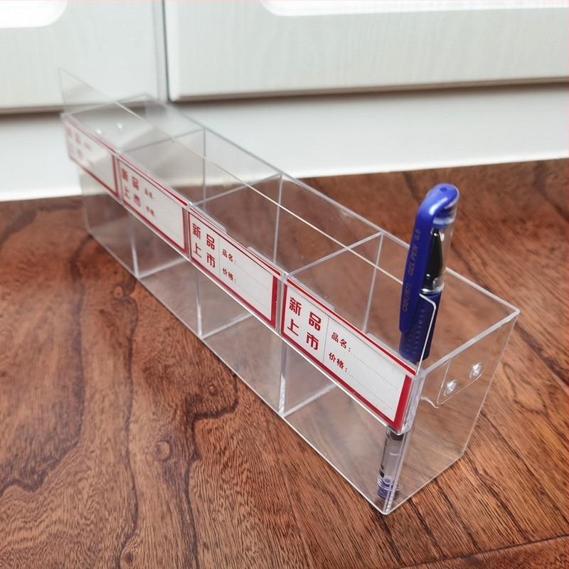 Üvegből készült tollkijelző állvány papír- és írószerboltban