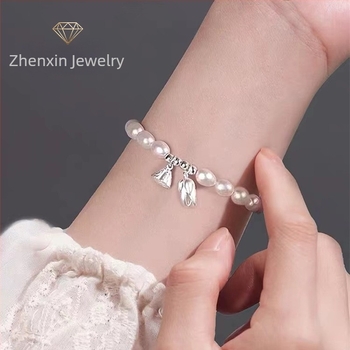 Gyöngy karkötő szerencsegyöngy és lotus motívummal, minimalist butik dizájn, luxus ékszerek