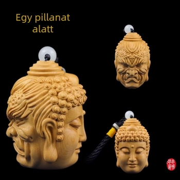 Tujafa finoman faragott Buddha fejű medál démon motívummal