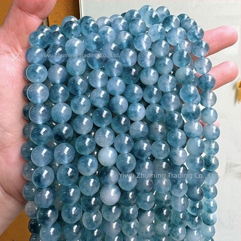 6 mm kalcedon golyógyöngyök sötétkék árnyalatban, jégszerű átlátszóság és virágos mintázat DIY karkötőhöz