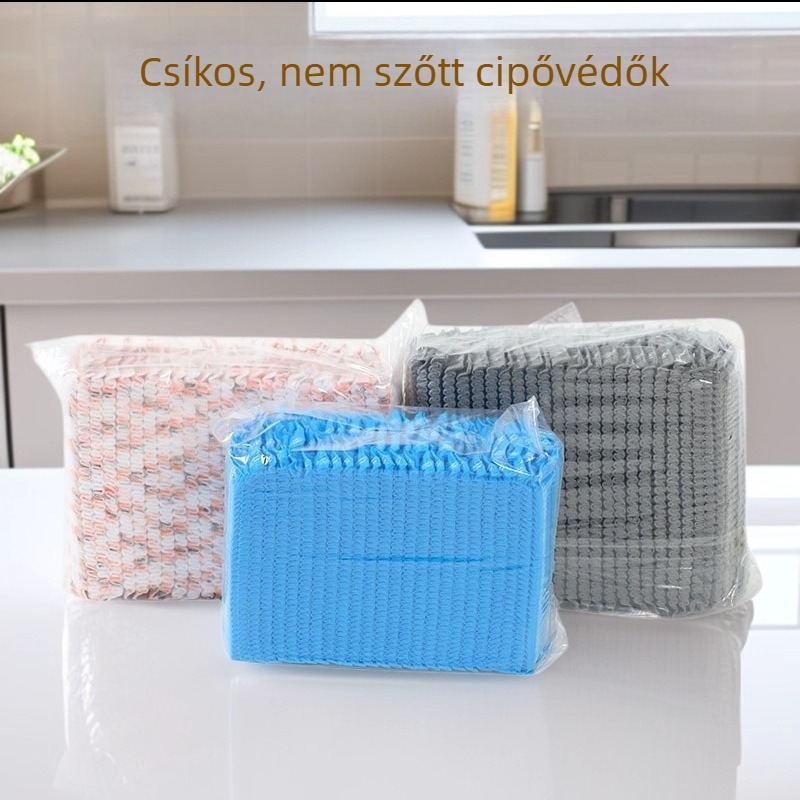 Sáv alakú egyszer használatos cipővédők nemszövött anyagból, beltéri műhelyekhez és gépteremhez, megerősített, por- és kopásálló, újrahasználható