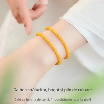 Brățară din chihlimbar cu montură din aur și inserții de jad, lucrată manual, design geometric