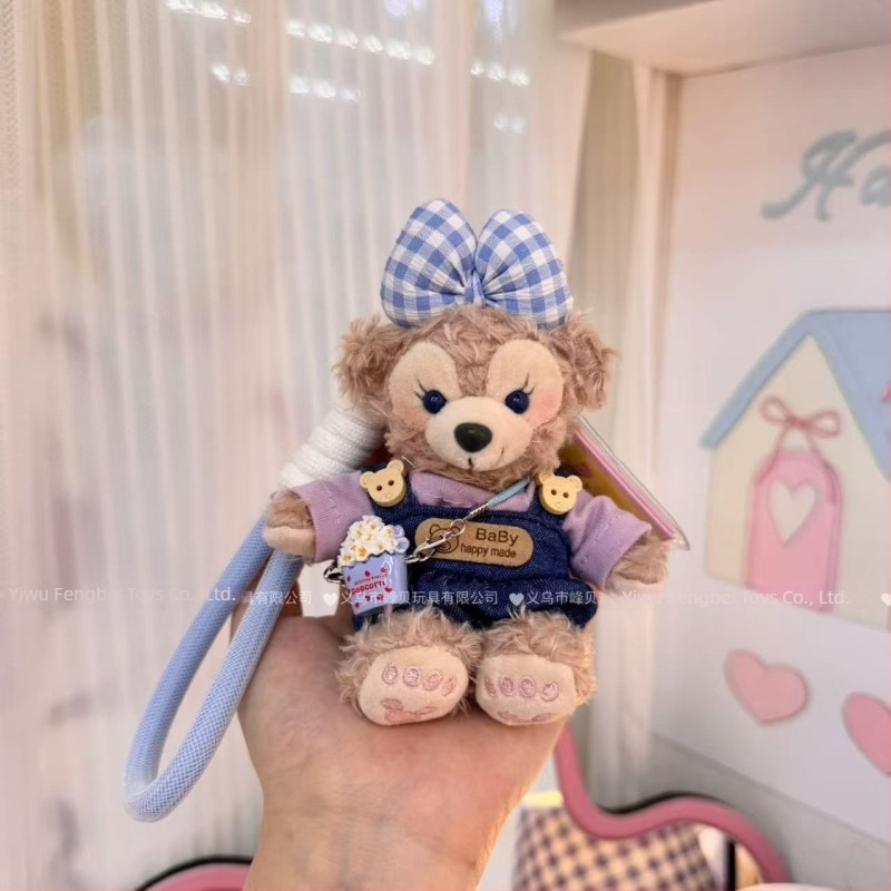 Păpușă ursuleț de pluș cu pandantiv, salopetă cu bretele și accesorii pentru îmbrăcare