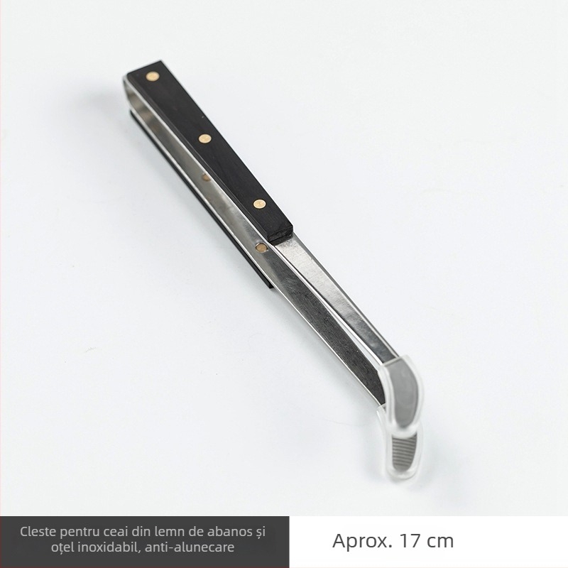 Set ceremonie ceai – șase domni, oțel inoxidabil, cu accente din lemn, cinci piese accesorii: clips pentru ceai, linguriță, ac pentru ceai și pix pentru prepararea ceaiului.