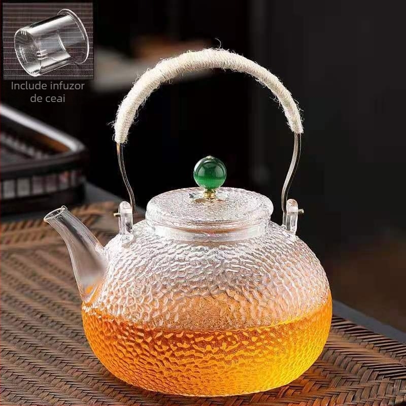 Ceainic din sticlă borosilicată cu mâner, model ciocănat; potrivit pentru plite electrice ceramice; poate fi folosit ca ceainic de ceai sau de apă, în formă de dovleac