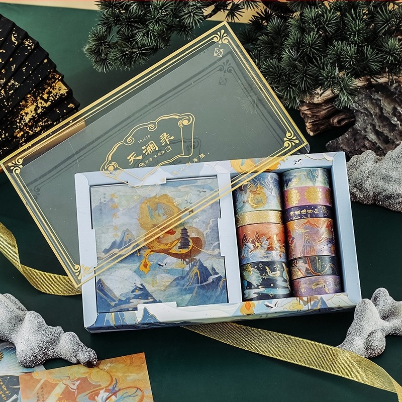 Seria Fuyou 10x10 bandă adezivă în cutie cadou, motiv păun, folie aurie – bandă decorativă pentru agende studențești