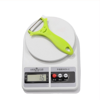 Peeler din oțel inoxidabil, mâner din plastic, cu față zâmbitoare – pentru fructe și legume