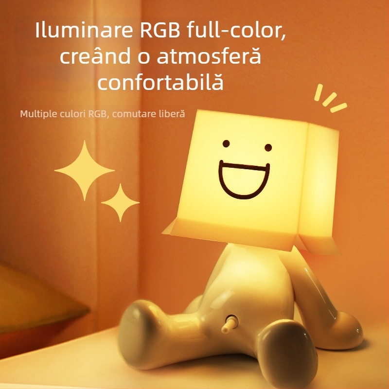 Lampă de birou RGB cu iluminare multicoloră, figurina drăguță a unui băiat timid într-o poziție șezândă, alimentare USB