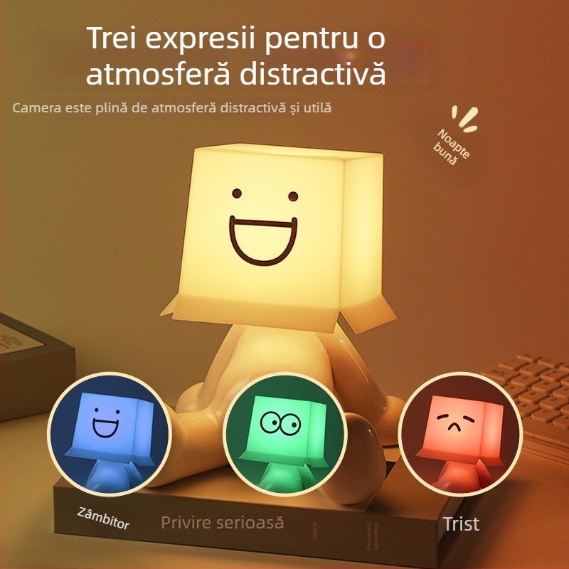 Lampă de birou RGB cu iluminare multicoloră, figurina drăguță a unui băiat timid într-o poziție șezândă, alimentare USB