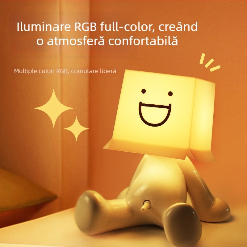 Lampă de birou RGB cu iluminare multicoloră, figurina drăguță a unui băiat timid într-o poziție șezândă, alimentare USB